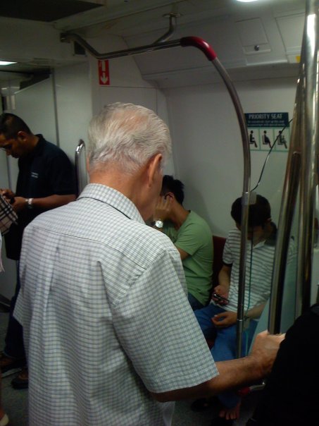old-man-standing in mrt