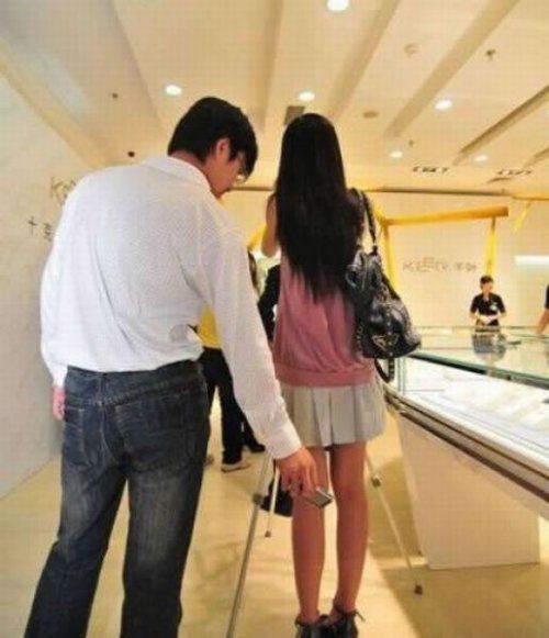 man_taking_upskirt_photo_15